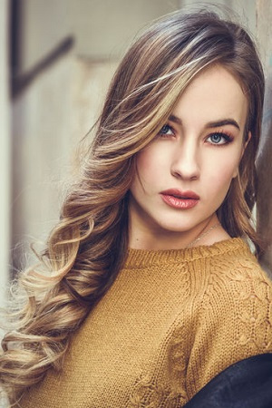 Beautiful blonde russian woman in urban background